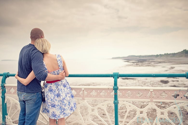 Cwtching on Penarth Pier - engagement photography