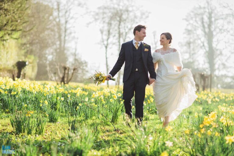 Bride and Groom in the Daffodils at Coombe Lodge