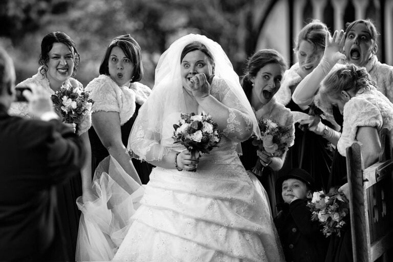 Bride laughing with bridesmaids before wedding in Oxford