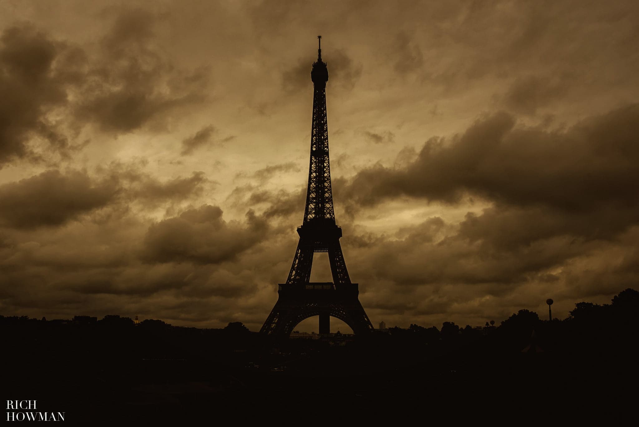 Eiffel tower in the clouds and rain