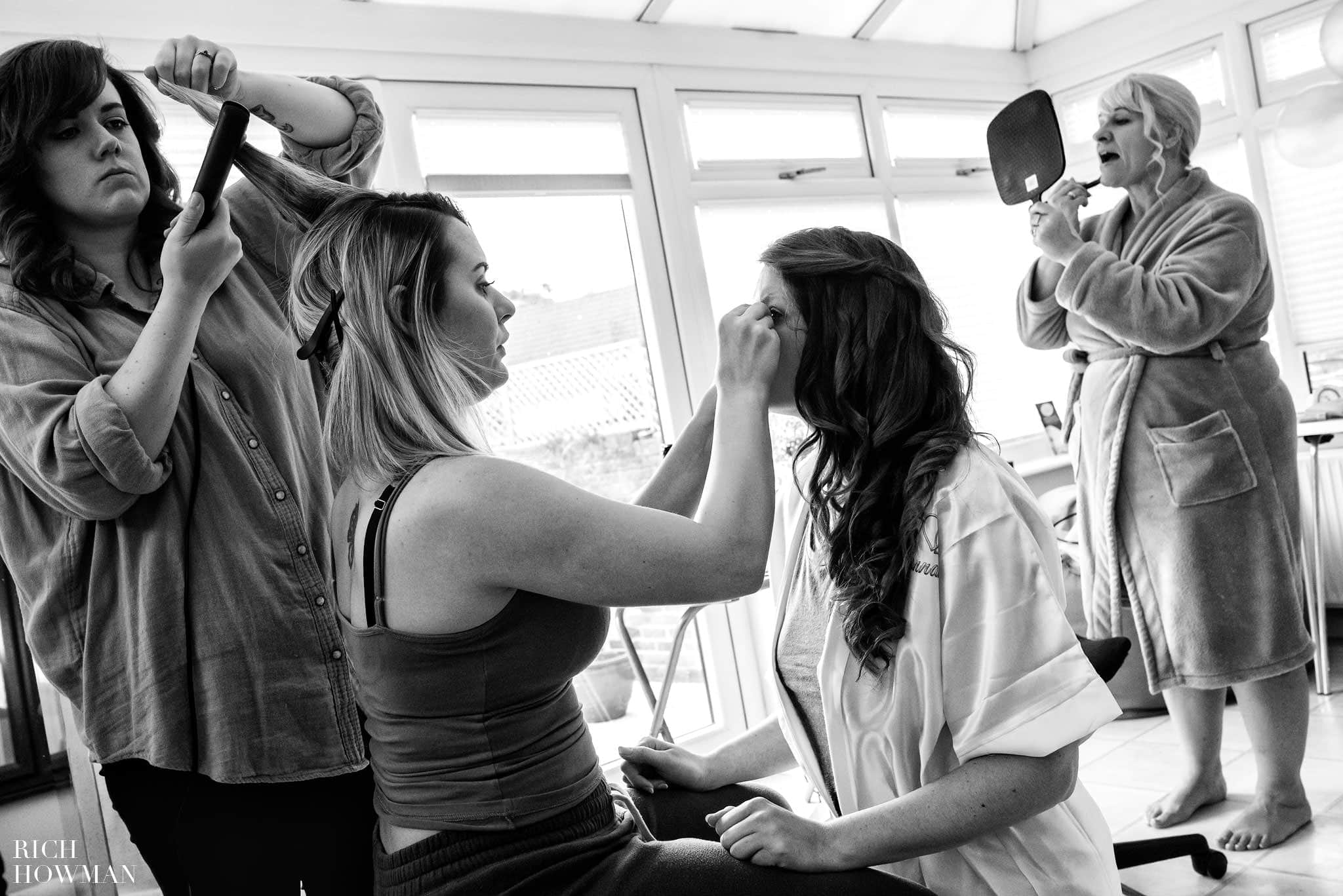 Black and white documentary wedding photography of bridal preparations on the morning of a wedding at the Bishops Palace in Somerset