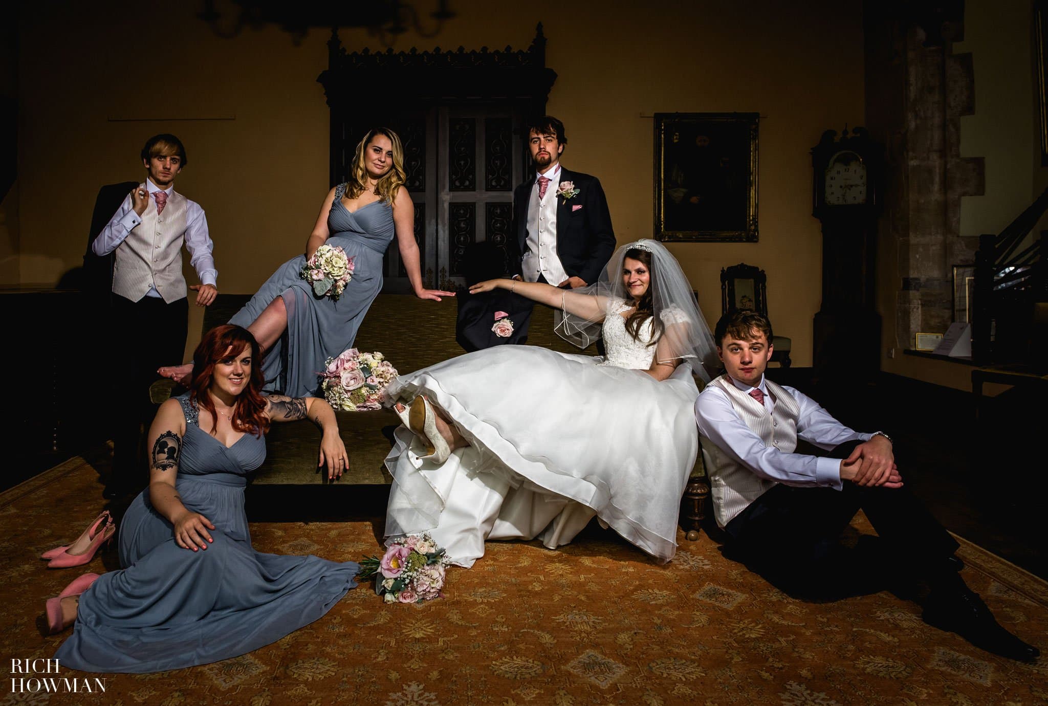 Relaxed wedding photo of the bridal party at the Bishops Palace Wells