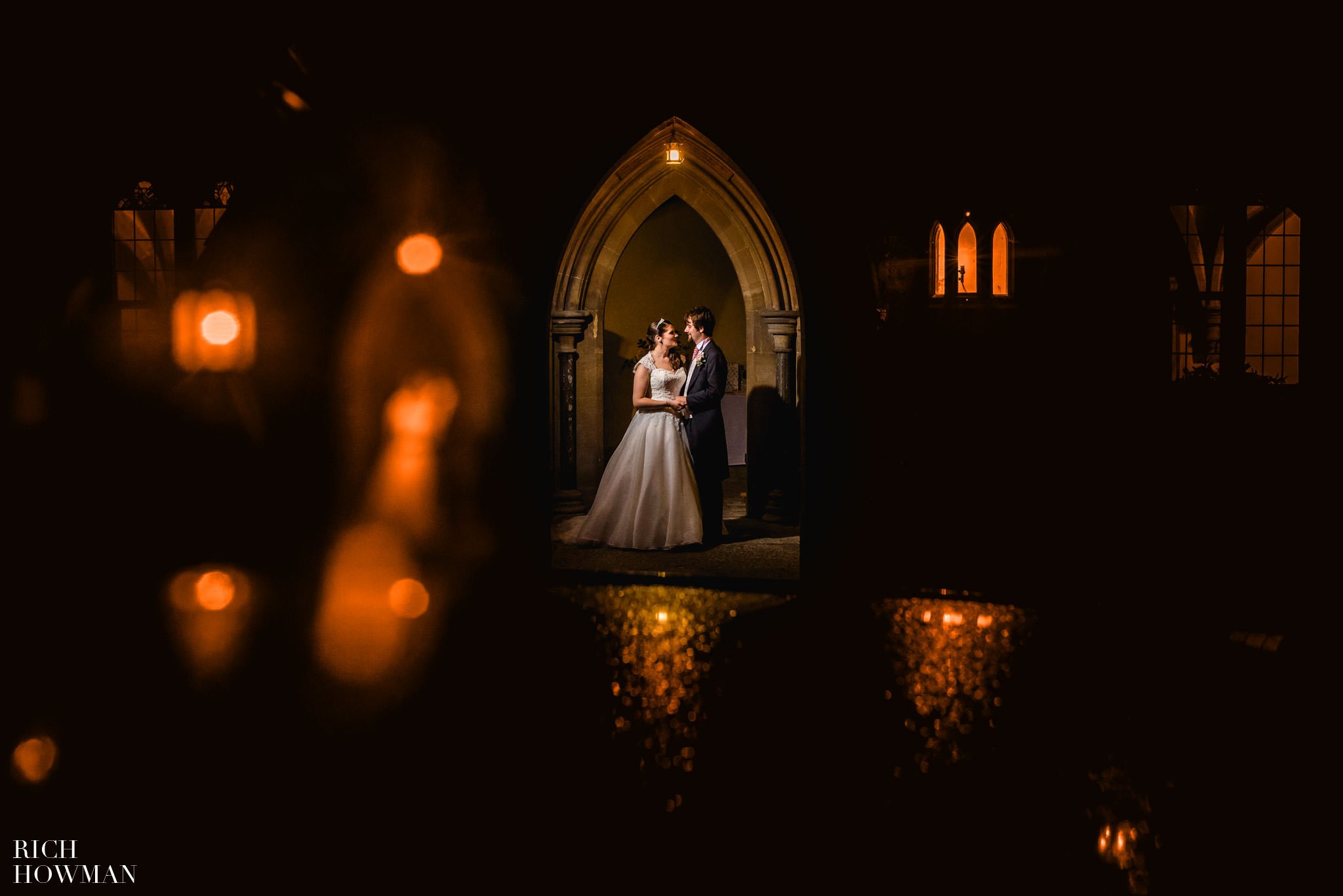 Creative portrait photograph of the bride and groom with light reflections