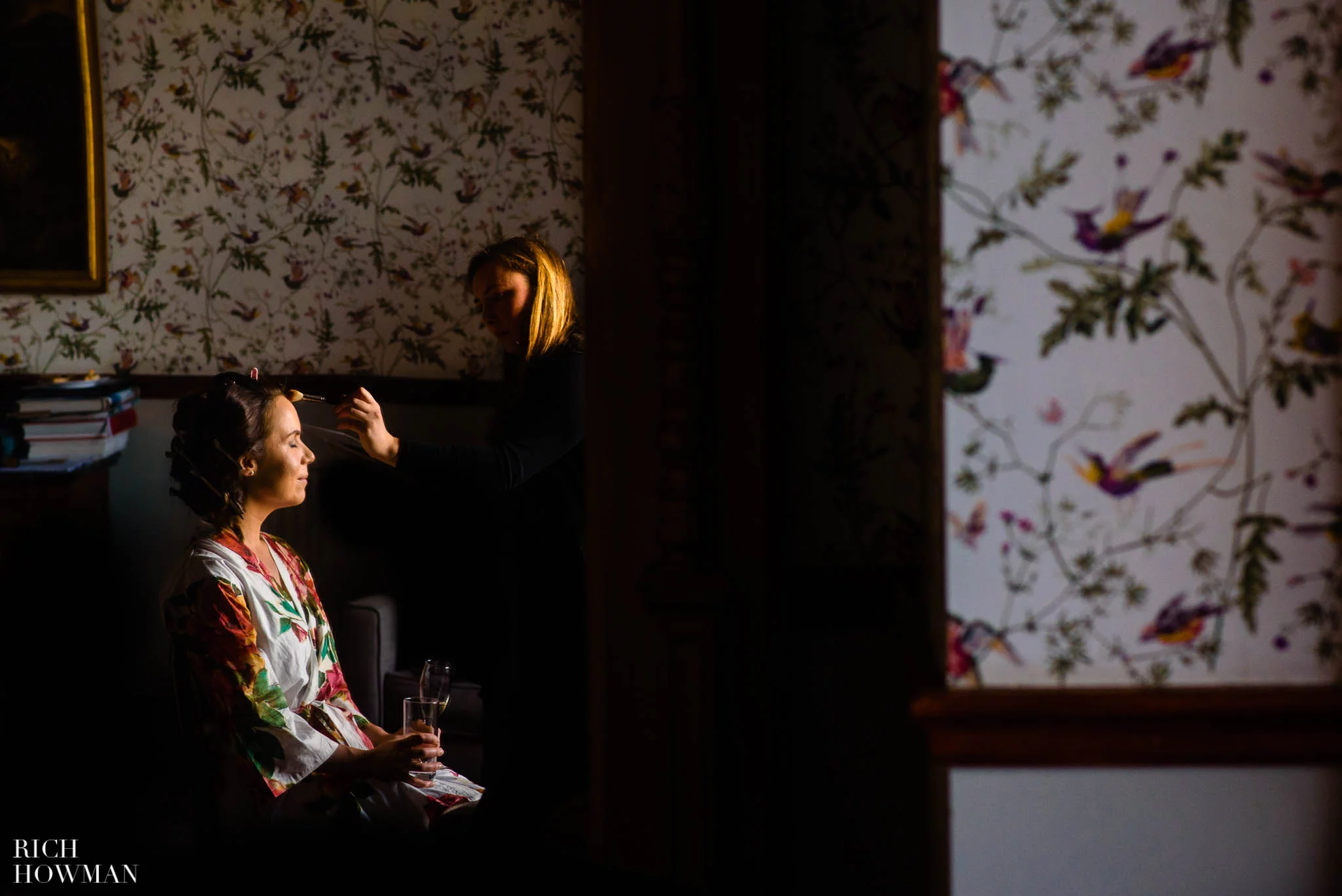 bridal prep in beautiful window light, captured by Huntsham Court wedding photographer, Rich Howman