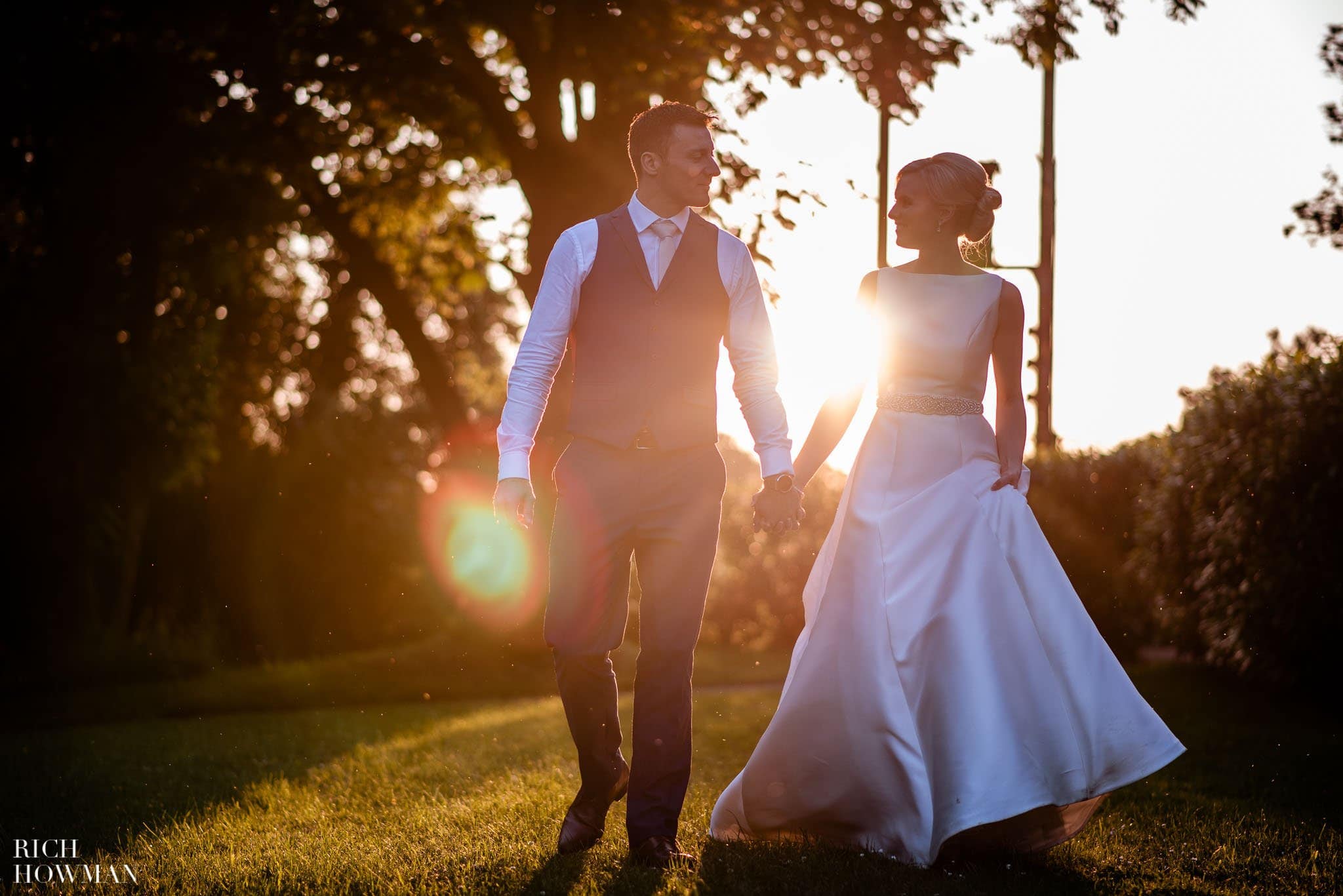 bride and groom at golden hour by eastington park wedding photographer rich howman