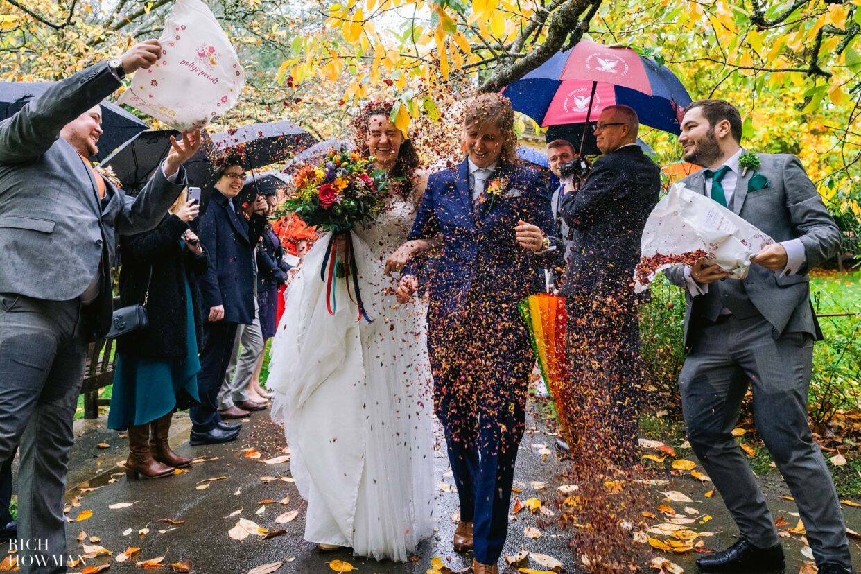brides showered in flower confetti, captured by bath wedding photographers from rich howman photography and film