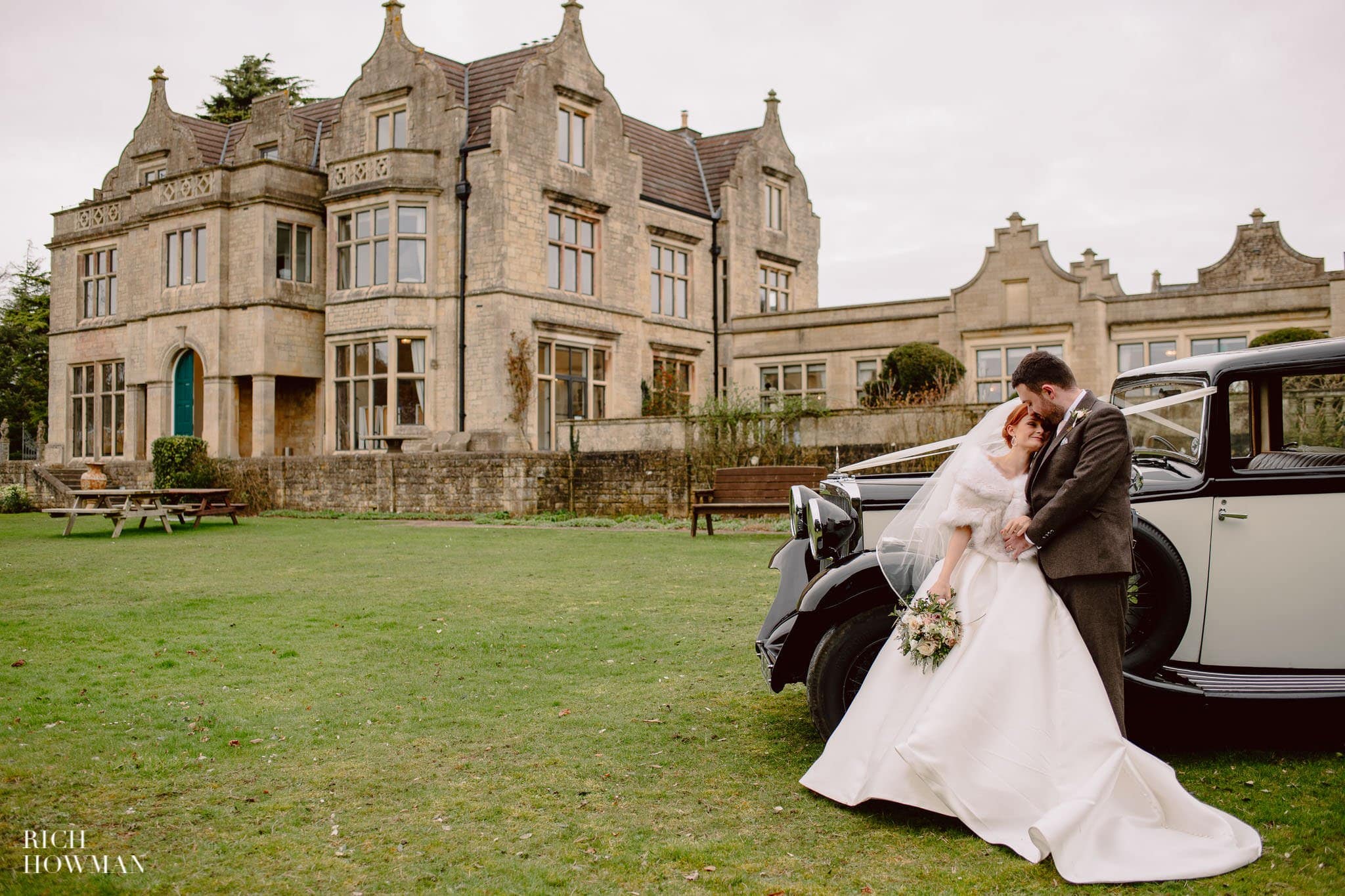 bride and groom in front of old down manor