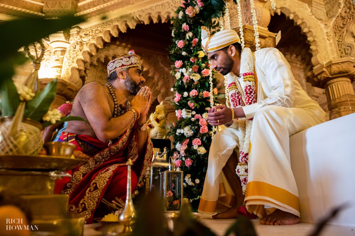 Tamil Hindu Wedding Photographer groom and priest in temple