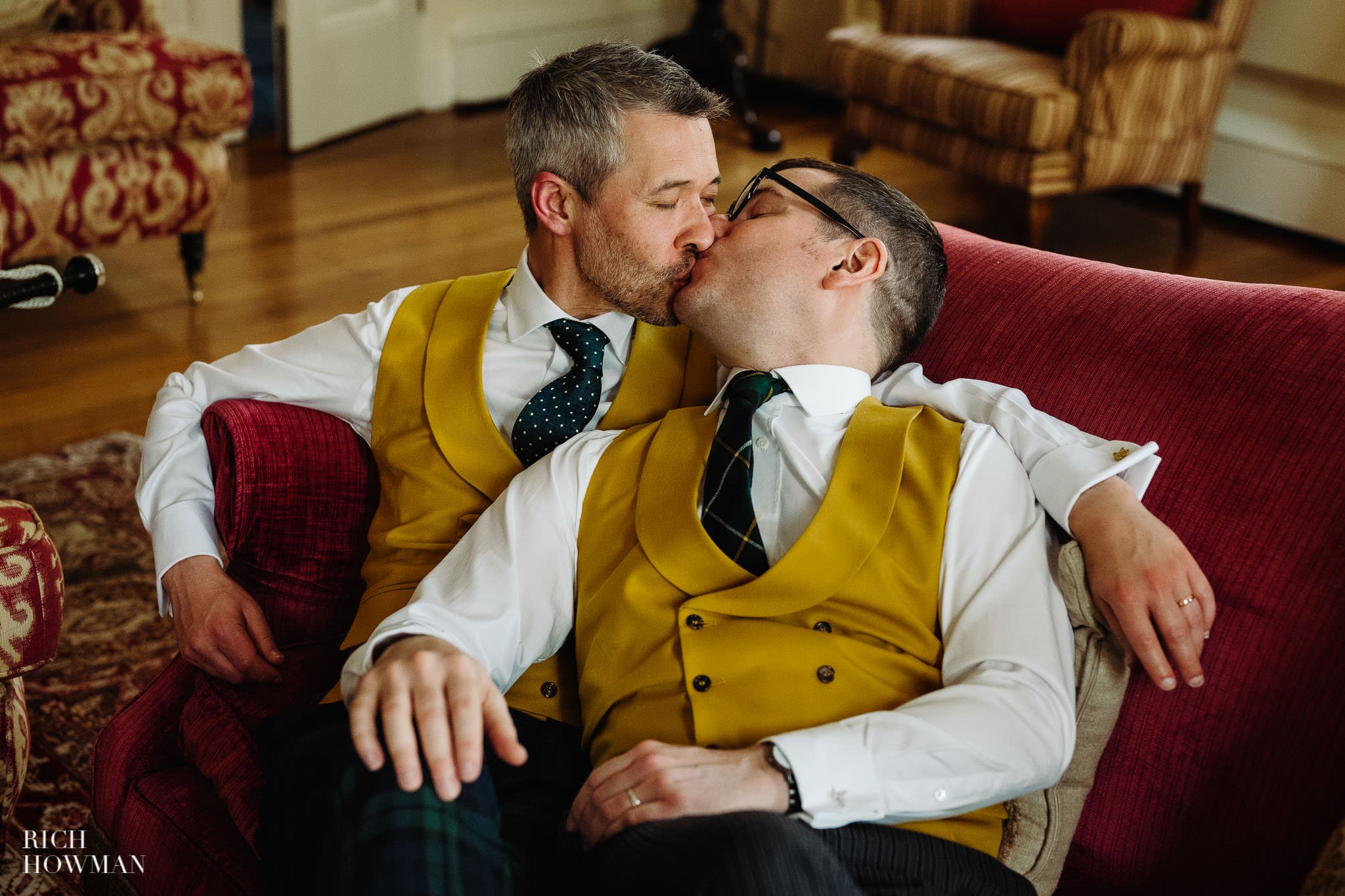grooms kiss as they recline after their ceremony, captured by inner temple wedding photographer Rich Howman