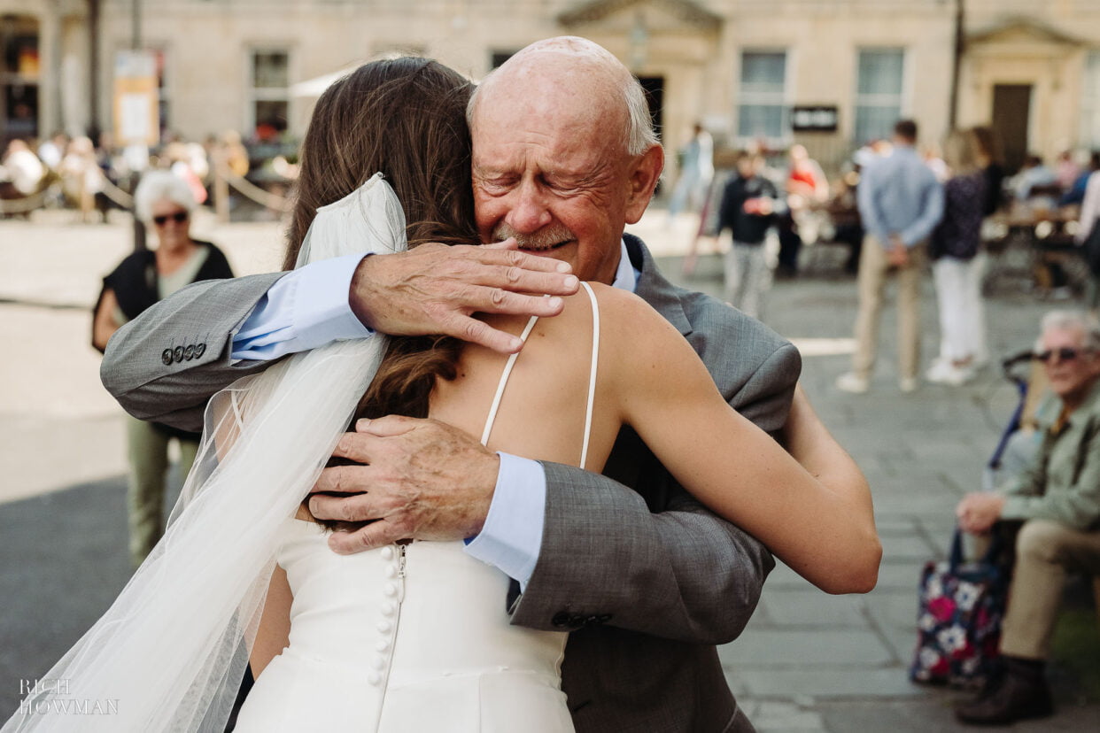 father embraces his daughter on her wedding day, captured by temple of minerva wedding photographer rich howman