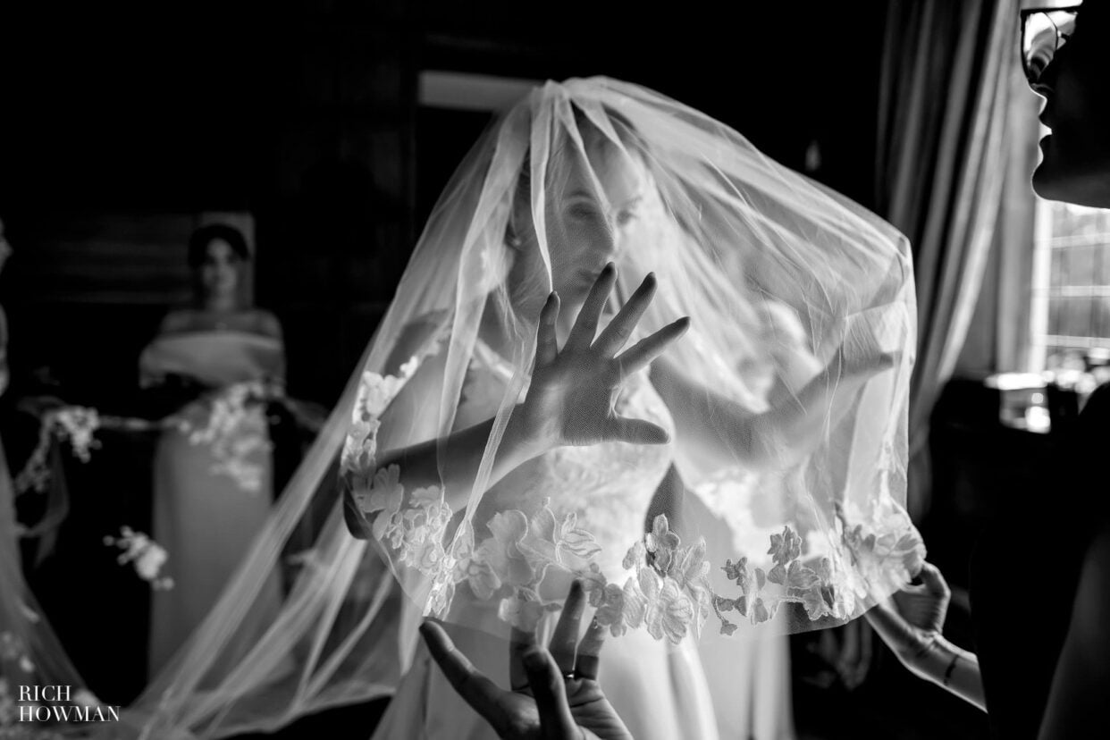 bride under veil in black and white, captured by hengrave hall wedding photographer, rich howman