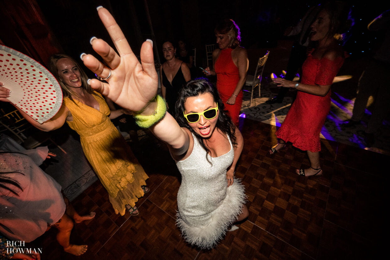 bride dancing, captured by Clevedon Hall wedding photographer, Rich Howman