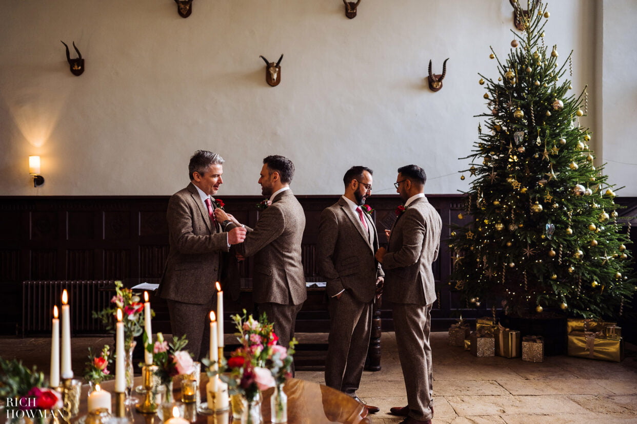 groom and his groomsmen preparing for the ceremony at a winter brympton house wedding