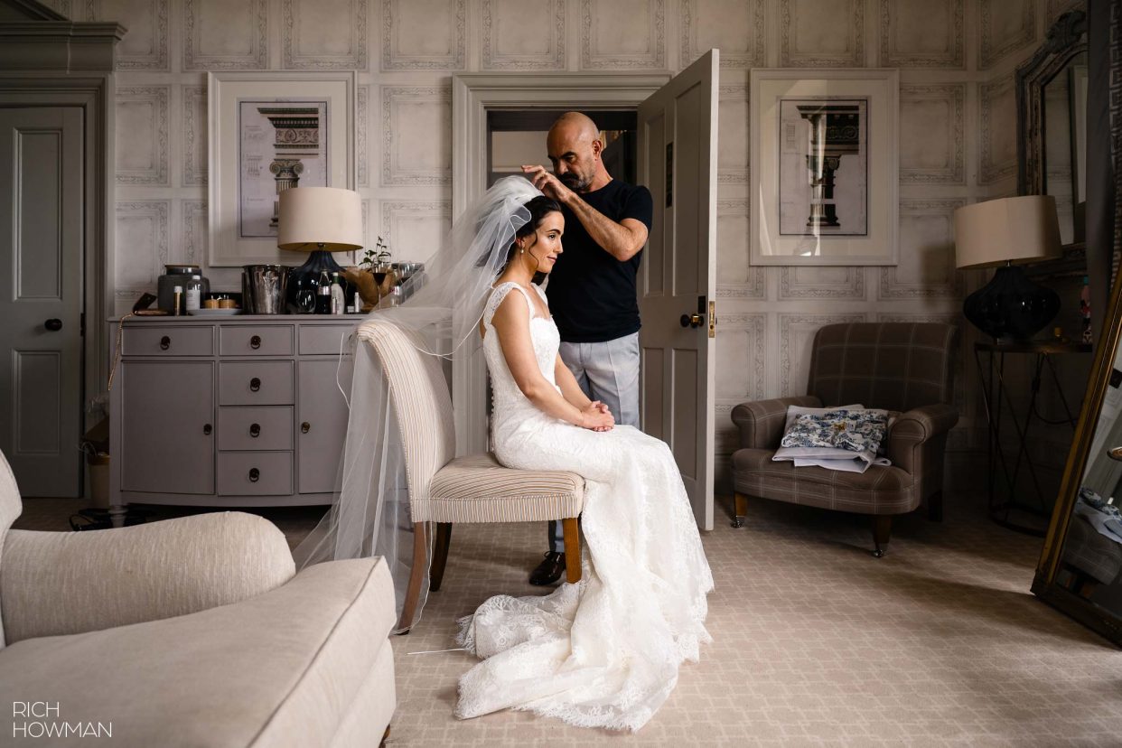 bride having her veil fitted in the bridal suite at Clevedon Hall, captured by Somerset wedding photographer, Rich Howman