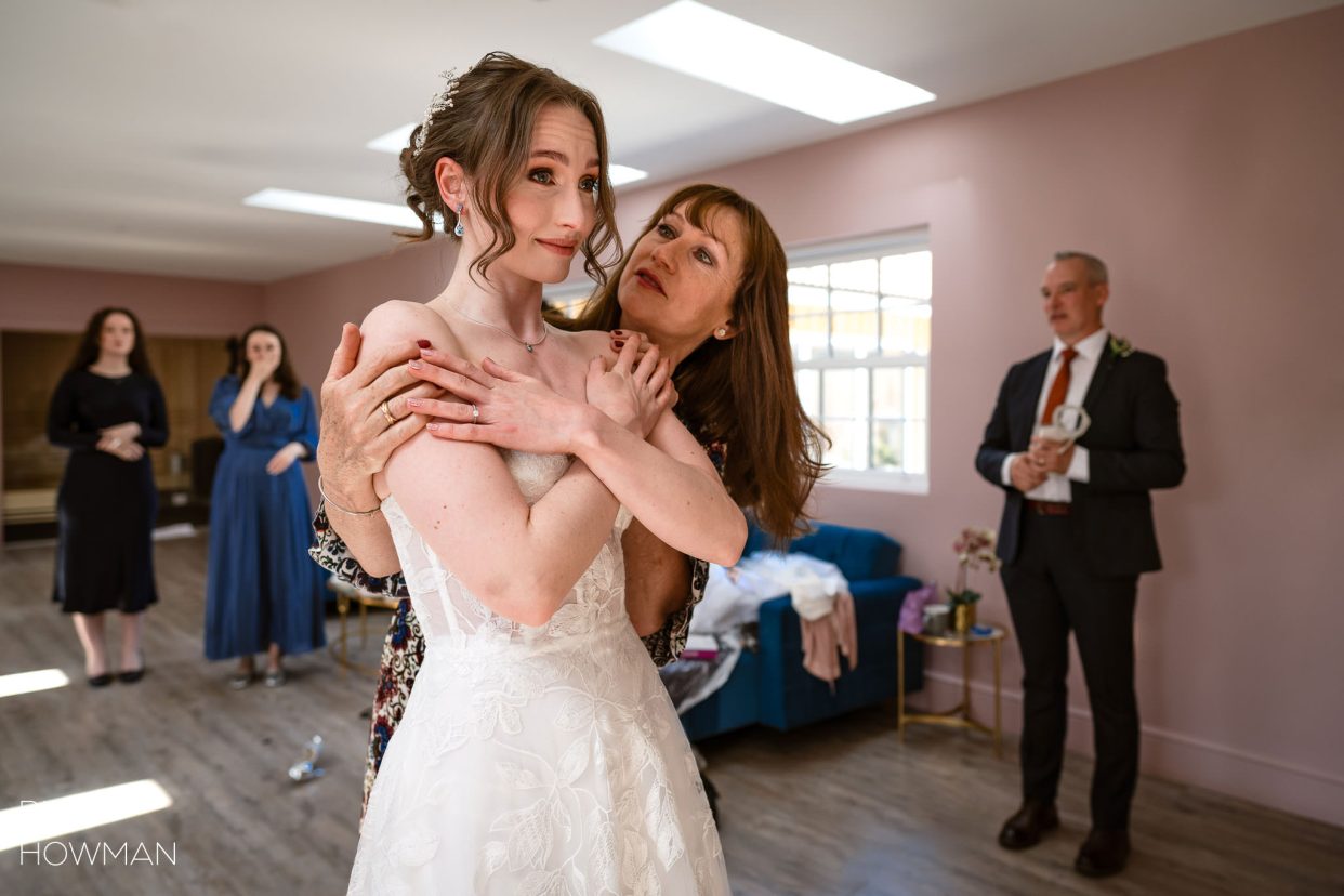 emotional bride in wedding dress, captured by Quantock Lakes wedding photographer, Rich Howman