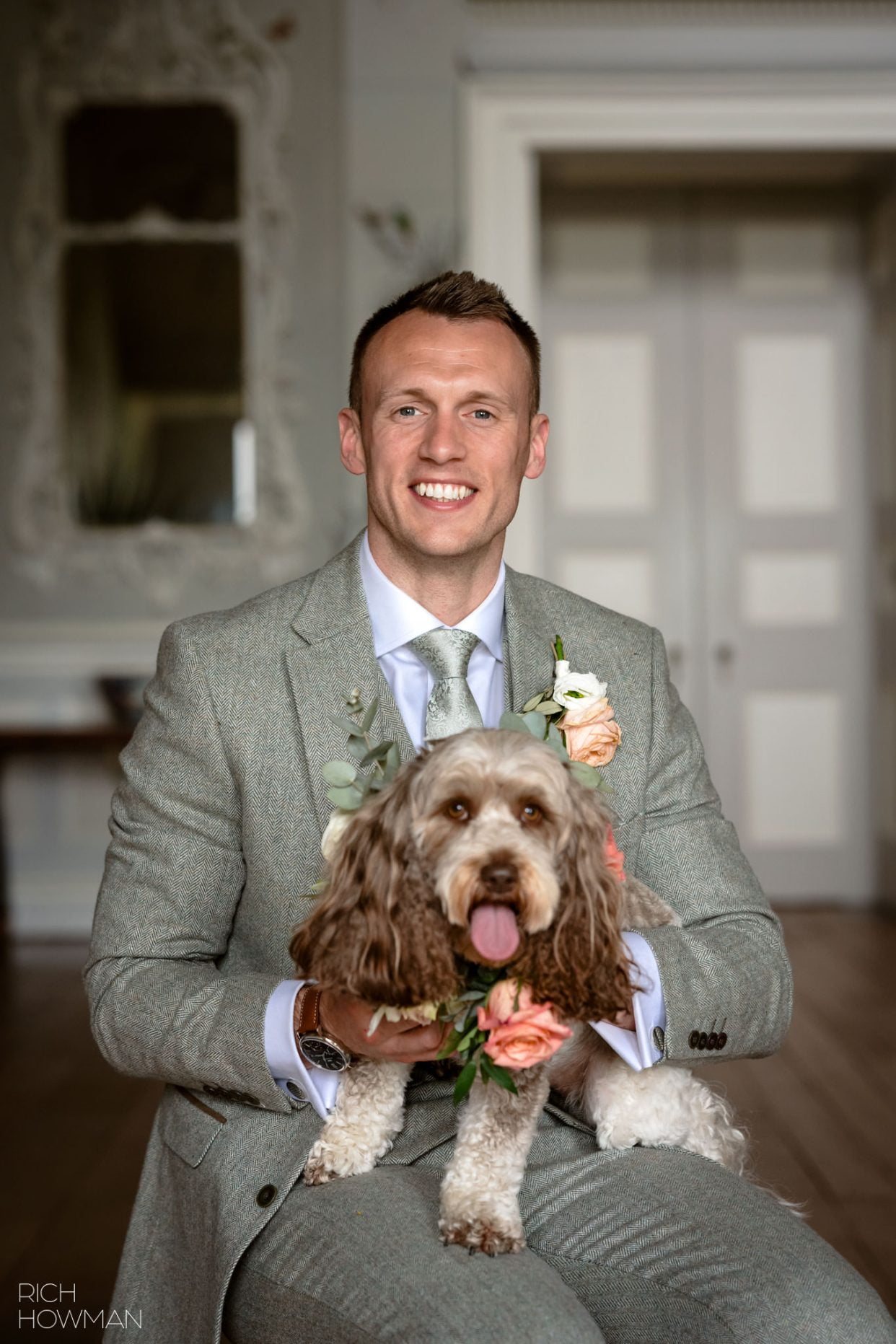 groom with dog, captured in Ragley Hall wedding photos by Rich Howman