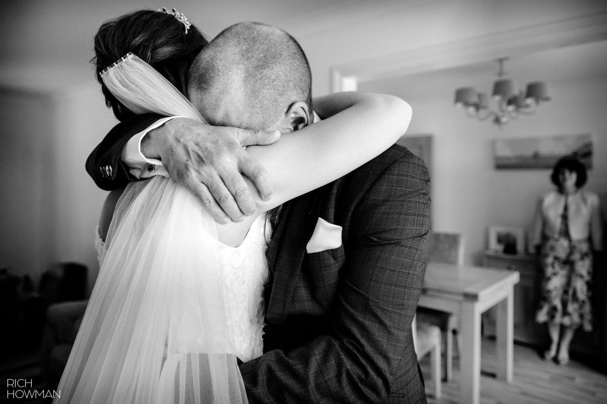 An emotional hug with the bride on her wedding day, captured by tetbury wedding photographer, Rich Howman