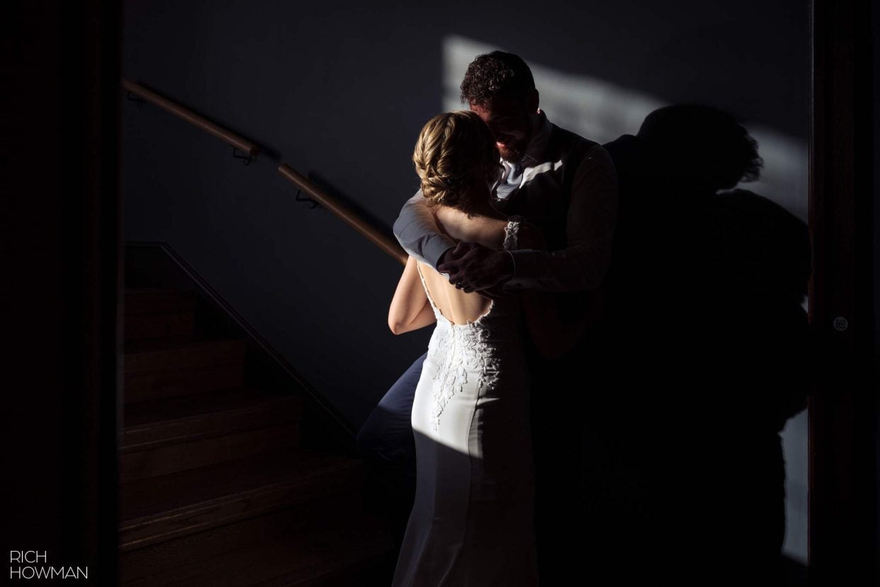 bride and groom creative portrait in a stairwell, captured by hotel du vin Bristol wedding photographer, Rich Howman