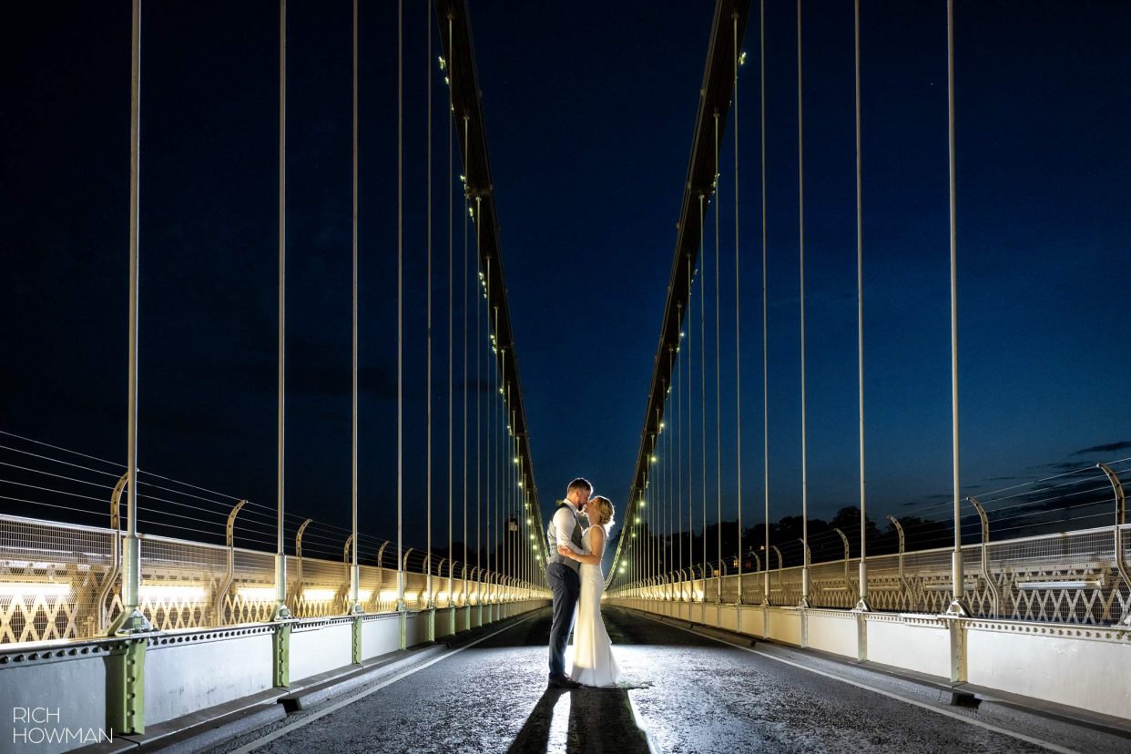 Bride and groom portrait on Clifton Suspension bridge, captured by hotel du vin Bristol wedding photographer, Rich Howman