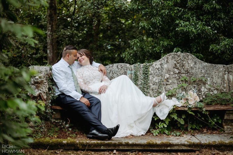 Hampton Manor Wedding Photographer Solihull Couple on stone bench